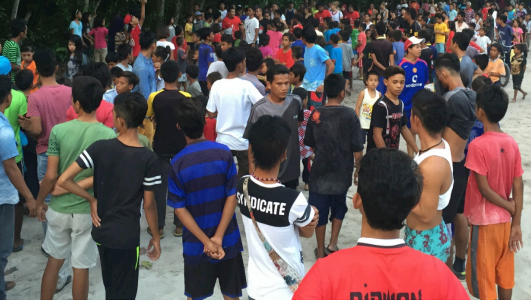 Students sorting collected plastic waste on Mabul